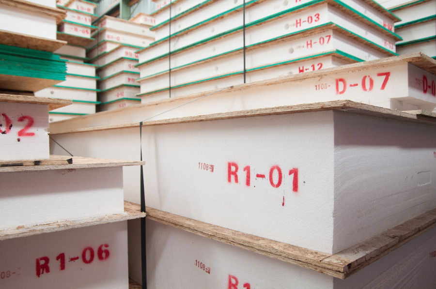 Each panel has a code on it, representing it's place in our house. You can also make out the pre-cut chase holes in the wall panels for our wiring to run through.