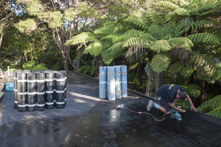 The roof fully primed while Rawere does some finishing touches to the parapet.