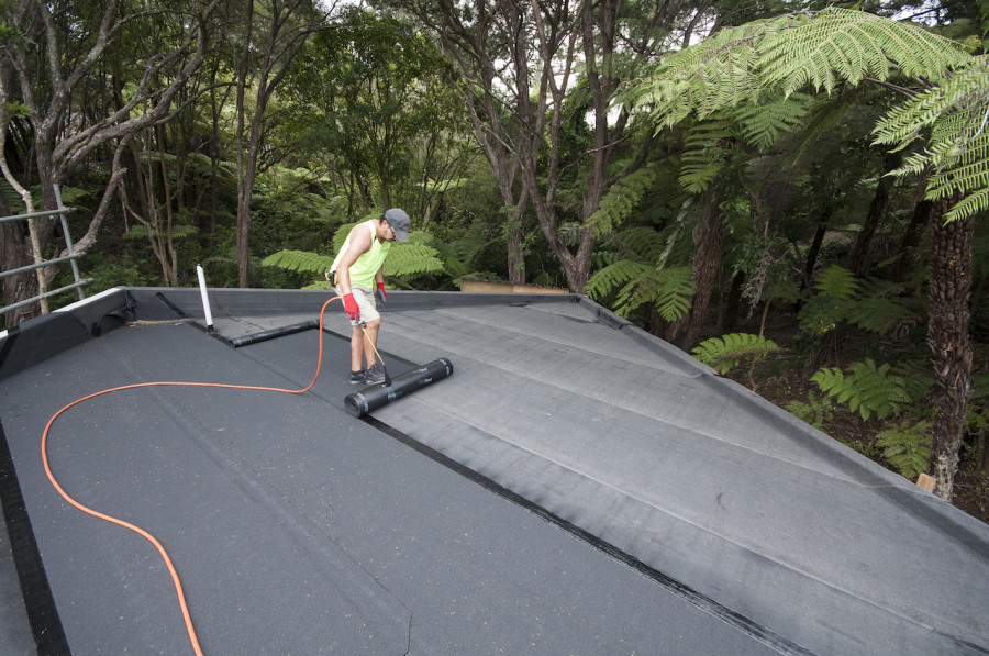 The bitumen cap sheet has a beautiful mineral chip finish and comes in about 5 colours. We chose the charcoal one to match the rest of our house.