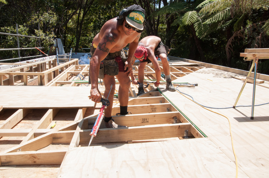 Then over the top of the framework the guys laid sheets of plywood which needed to be glued and screwed down. 