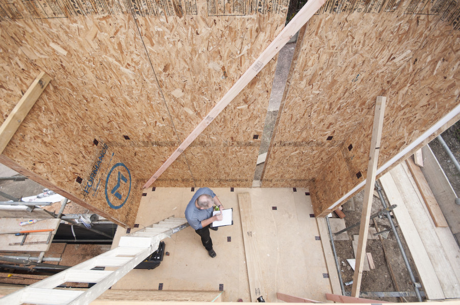 With everything in place, Mike then took down all the measurements. You can also get a sense of the space from this photo, a tall column leading up to our roof deck.