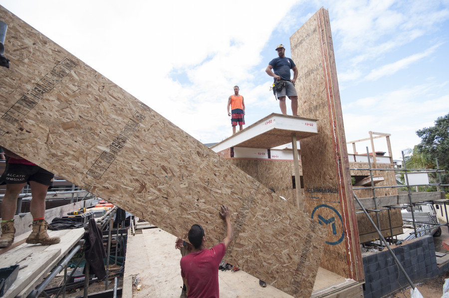 The guys installing the giant panels that form our entry foyer and stair well up to the roof top deck.