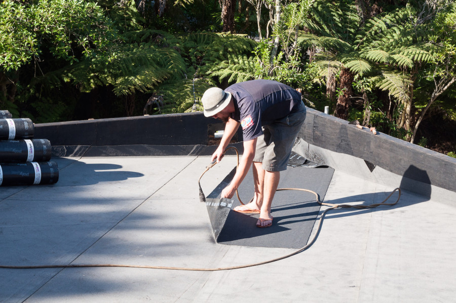 Lyndon wears jandals so as not to damage the cap sheet which becomes very soft when hot.